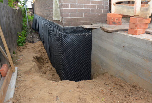 SJ Waterproofing Pros technician performing targeted Emergency Waterproofing assessment in Danville, PA